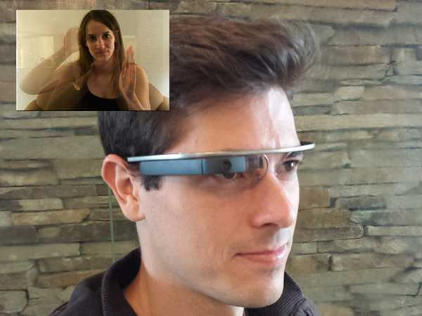 User wearing a Google Glass. The Google Glass is displaying an American Sign Language interpreter gesturing.