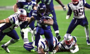 Feb 1, 2015; Glendale, AZ, USA; Seattle Seahawks running back Marshawn Lynch (24) carries the ball past New England Patriots defensive tackle Vince Wilfork (75) and Rob Ninkovich (50) during the third quarter in Super Bowl XLIX at University of Phoenix Stadium. Mandatory Credit: Andrew Weber-USA TODAY Sports ORG XMIT: USATSI-185920 ORIG FILE ID: 20150201_rvr_aw3_183.jpg